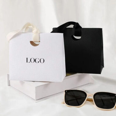 Personalized shopping paper bags with ribbon handles for boutiques
