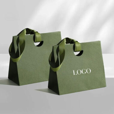 Personalized shopping paper bags with ribbon handles for boutiques