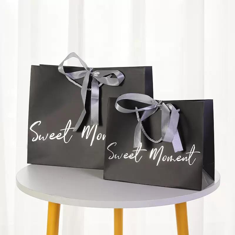 Luxury garment gift paper bags for fashion and boutique packaging