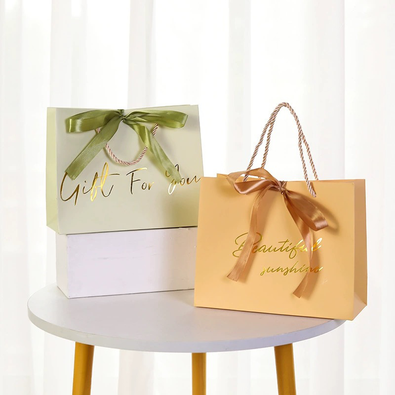 Luxury garment gift paper bags for fashion and boutique packaging