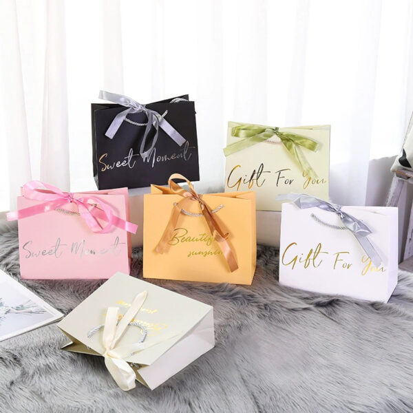 Luxury garment gift paper bags for fashion and boutique packaging