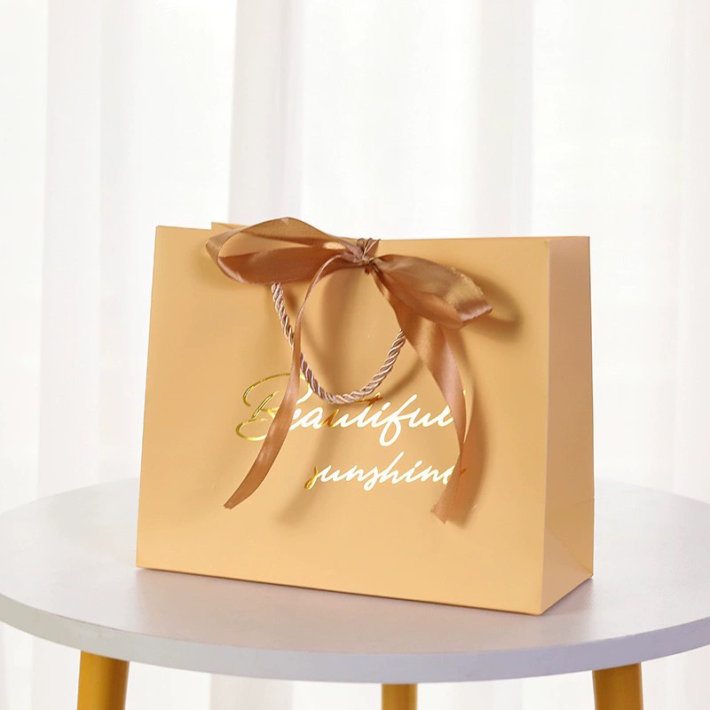 Luxury garment gift paper bags for fashion and boutique packaging