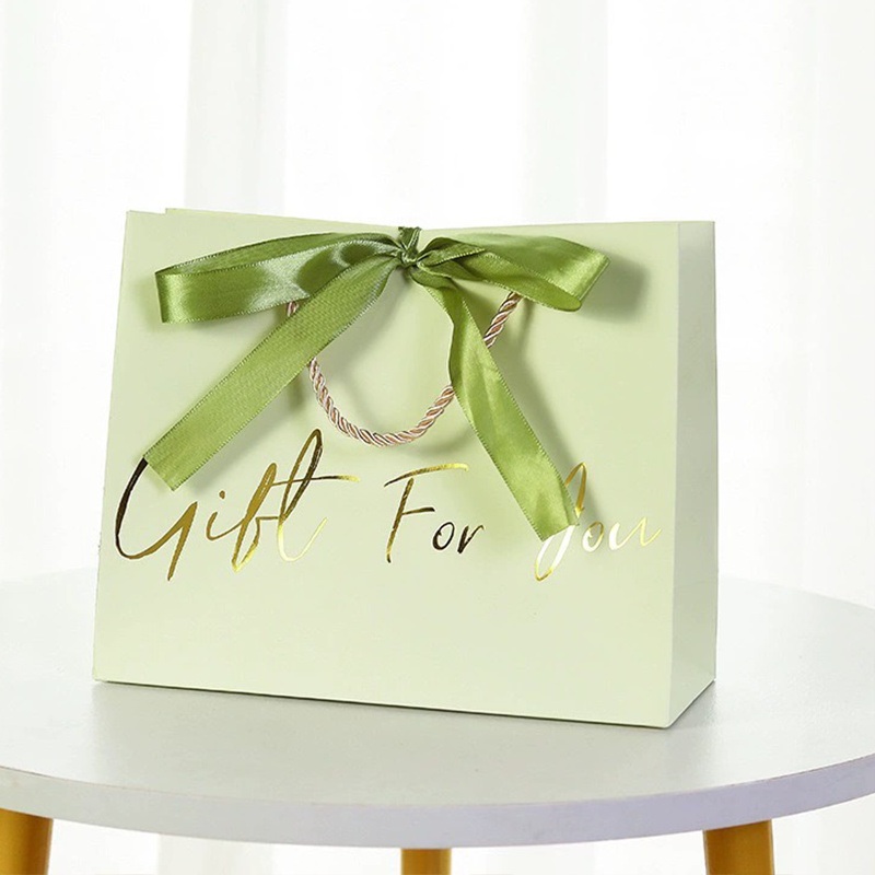 Luxury garment gift paper bags for fashion and boutique packaging