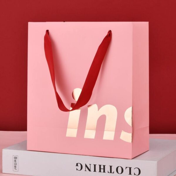 Luxury clothing and gift shopping paper bags with custom logos