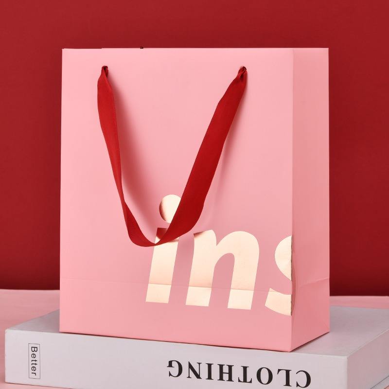 Luxury clothing and gift shopping paper bags with custom logos