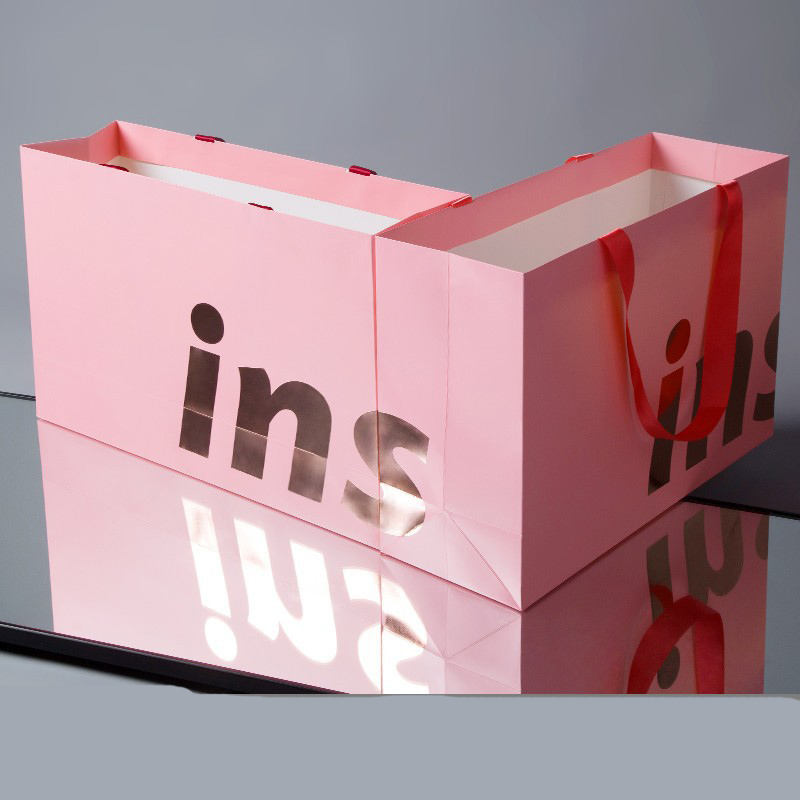 Luxury clothing and gift shopping paper bags with custom logos