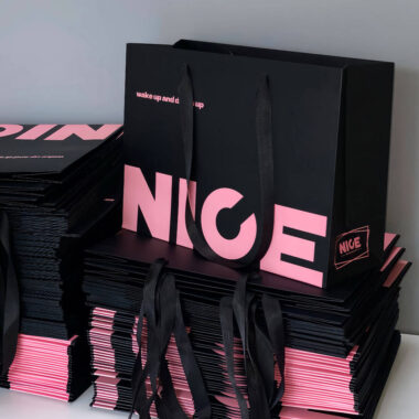 Luxury gift shopping paper bags with ribbon handles and custom logos