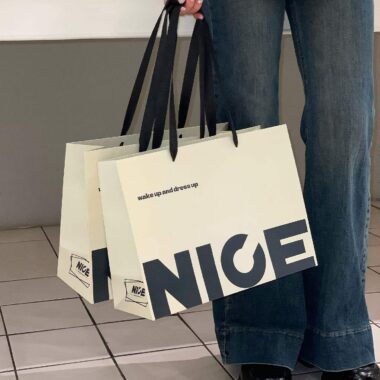 Luxury gift shopping paper bags with ribbon handles and custom logos
