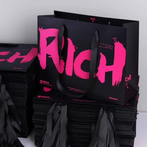 Luxury gift shopping paper bags with ribbon handles and custom logos
