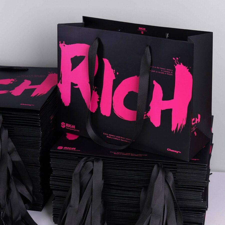 Luxury gift shopping paper bags with ribbon handles and custom logos