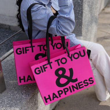Luxury gift shopping paper bags with ribbon handles and custom logos