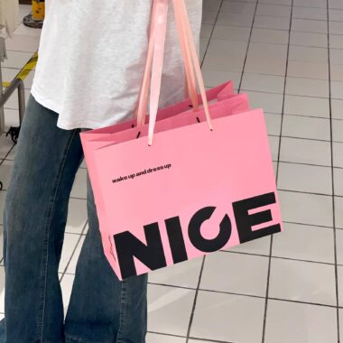 Luxury gift shopping paper bags with ribbon handles and custom logos