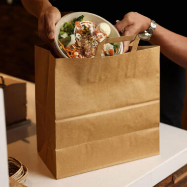 Biodegradable brown kraft paper bags for grocery and gift packaging