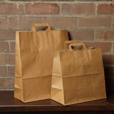 Biodegradable brown kraft paper bags for grocery and gift packaging